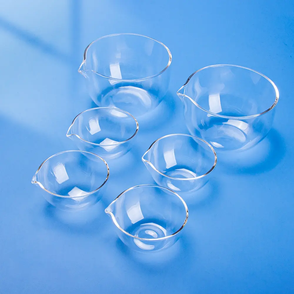 Collection of clear quartz evaporating dishes in various sizes.