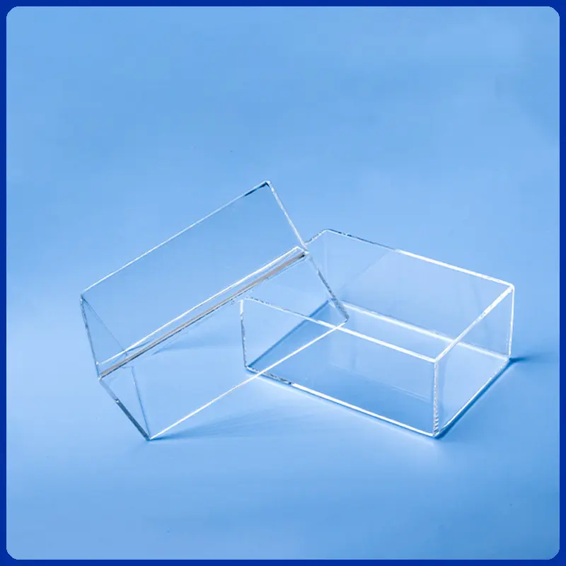 Two clear rectangular open-top quartz glass containers or tanks.