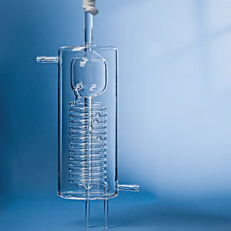 Complex laboratory quartz glass apparatus, possibly a condenser or reactor, featuring an internal spiral tube.