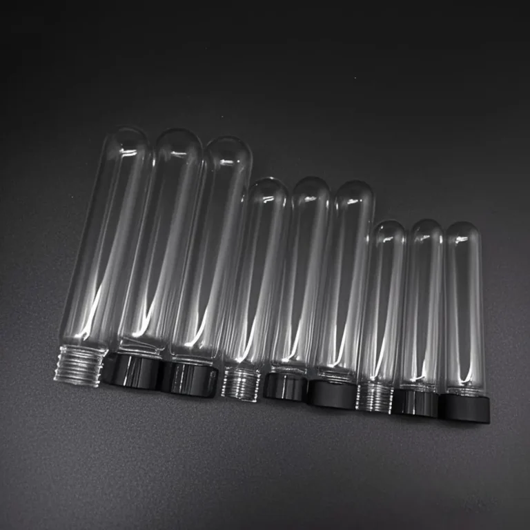 Collection of clear round bottom quartz glass screw top vials with black caps in various sizes