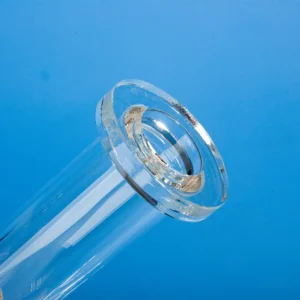 Close-up view of the polished flange end of a clear quartz tube connector