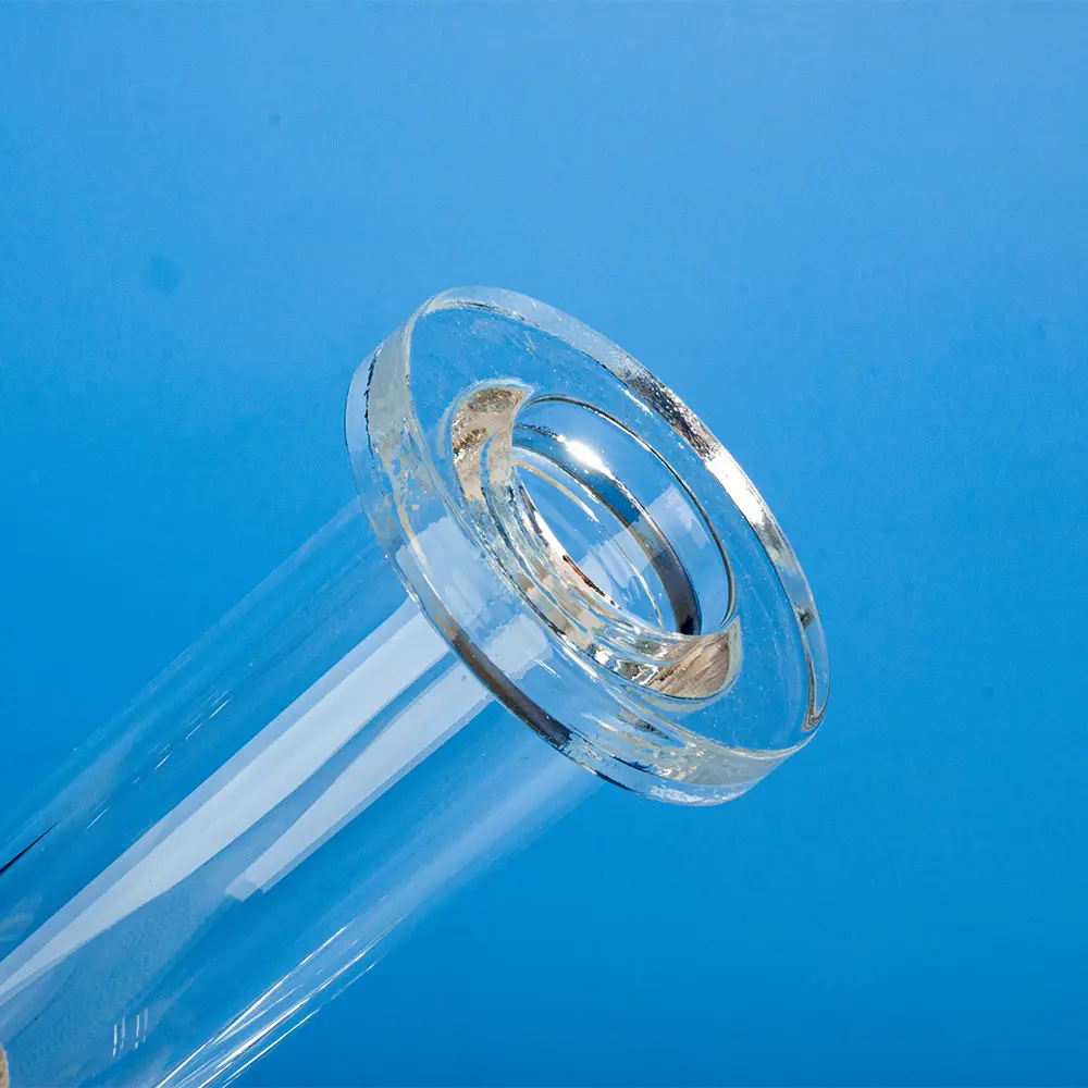 Close-up view of the polished flange end of a clear quartz tube connector