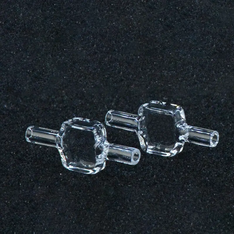 Two clear 10mm pathlength quartz fluorescence flow cells displayed side-by-side on a black surface