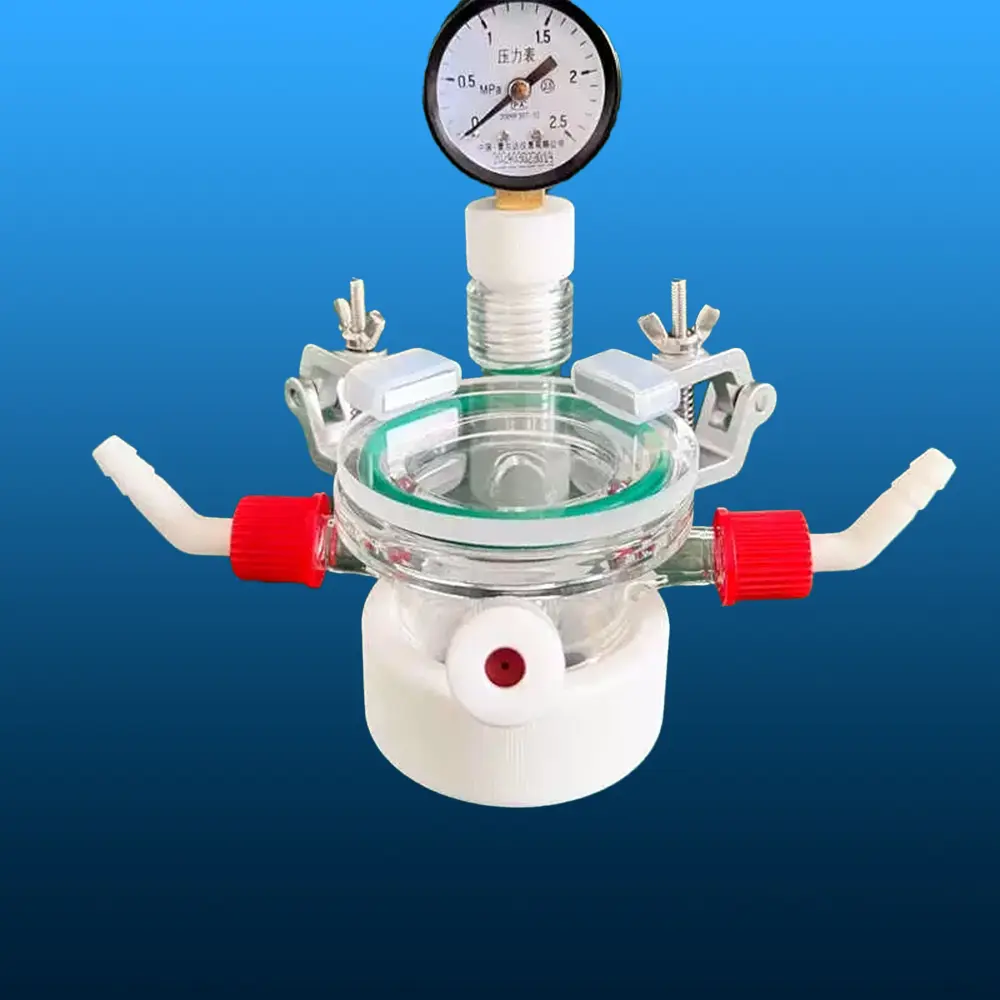 Assembled clear quartz photocatalytic reactor with pressure gauge, clamps, and side ports, front view.