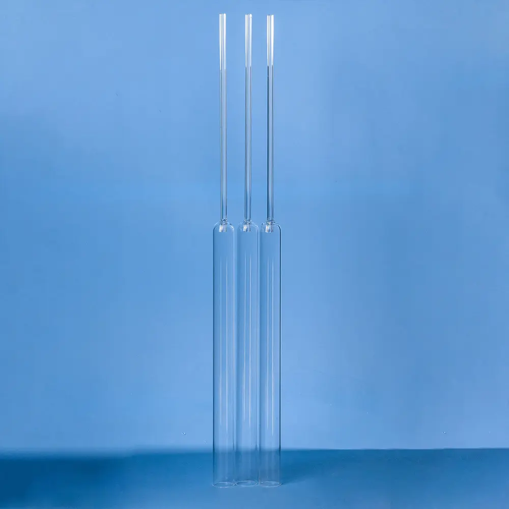 Three clear quartz combustion tubes standing vertically, various lengths or diameters implied.