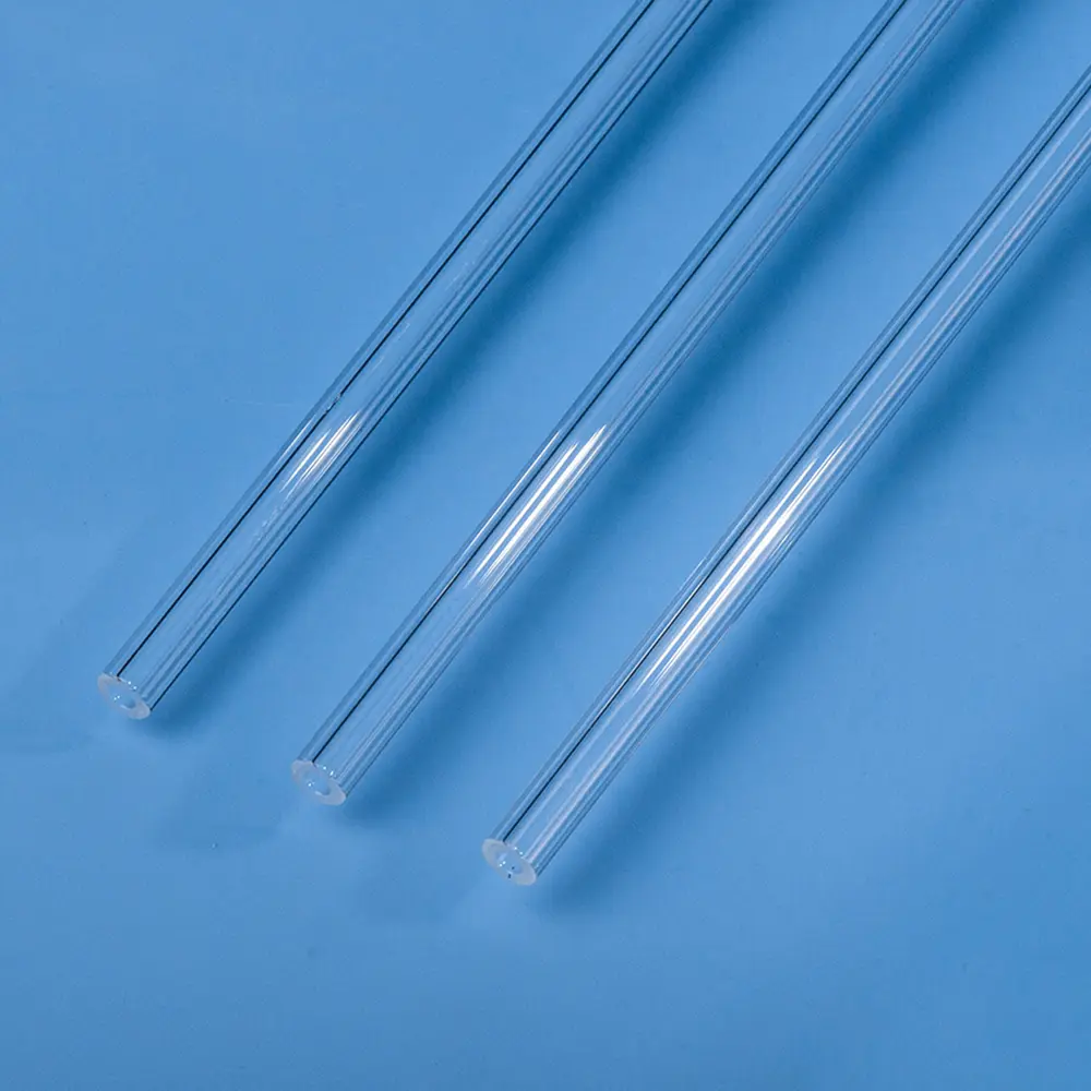 Set of three long, clear quartz reactor tubes for high-temperature chemical reactions.