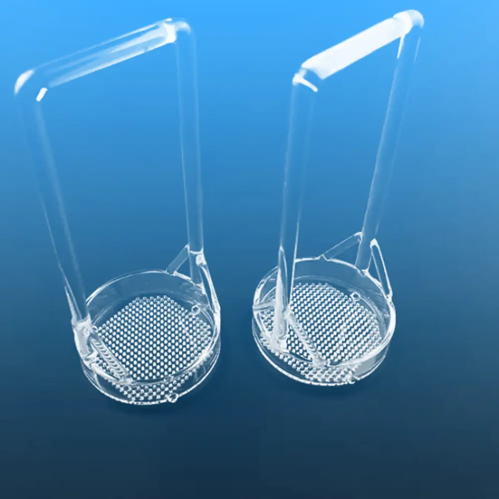 Two clear quartz wafer carriers with long handles and round perforated bases for semiconductor cleaning