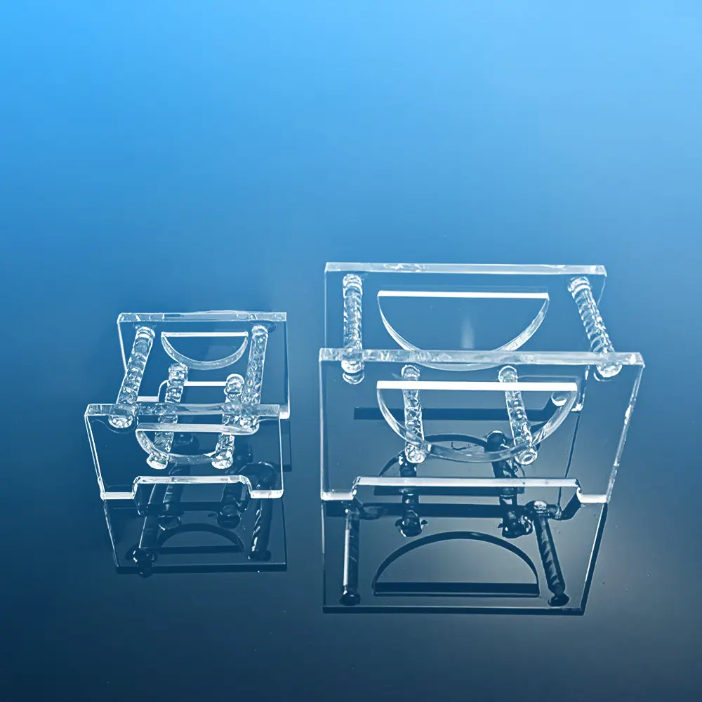 Two clear slotted quartz wafer cleaning racks of different sizes shown side-by-side for comparison