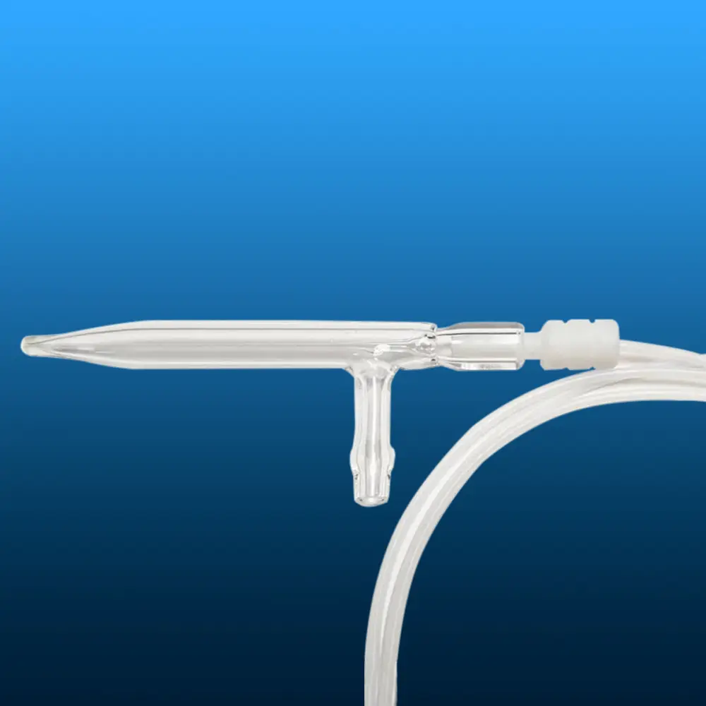 Close-up of a quartz nozzle connected to a white tube via its side arm, on a blue background