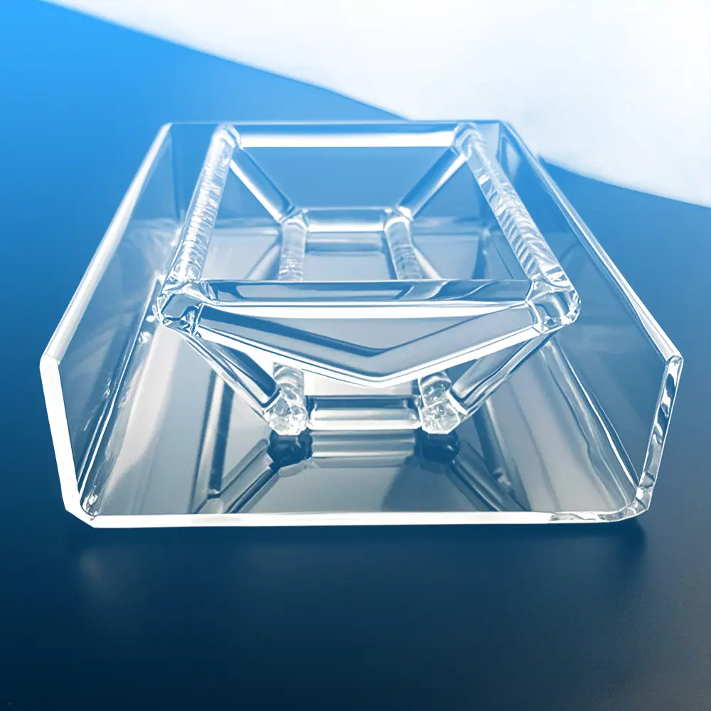 Front view of a clear slotted quartz boat positioned inside its carrier tray/box.