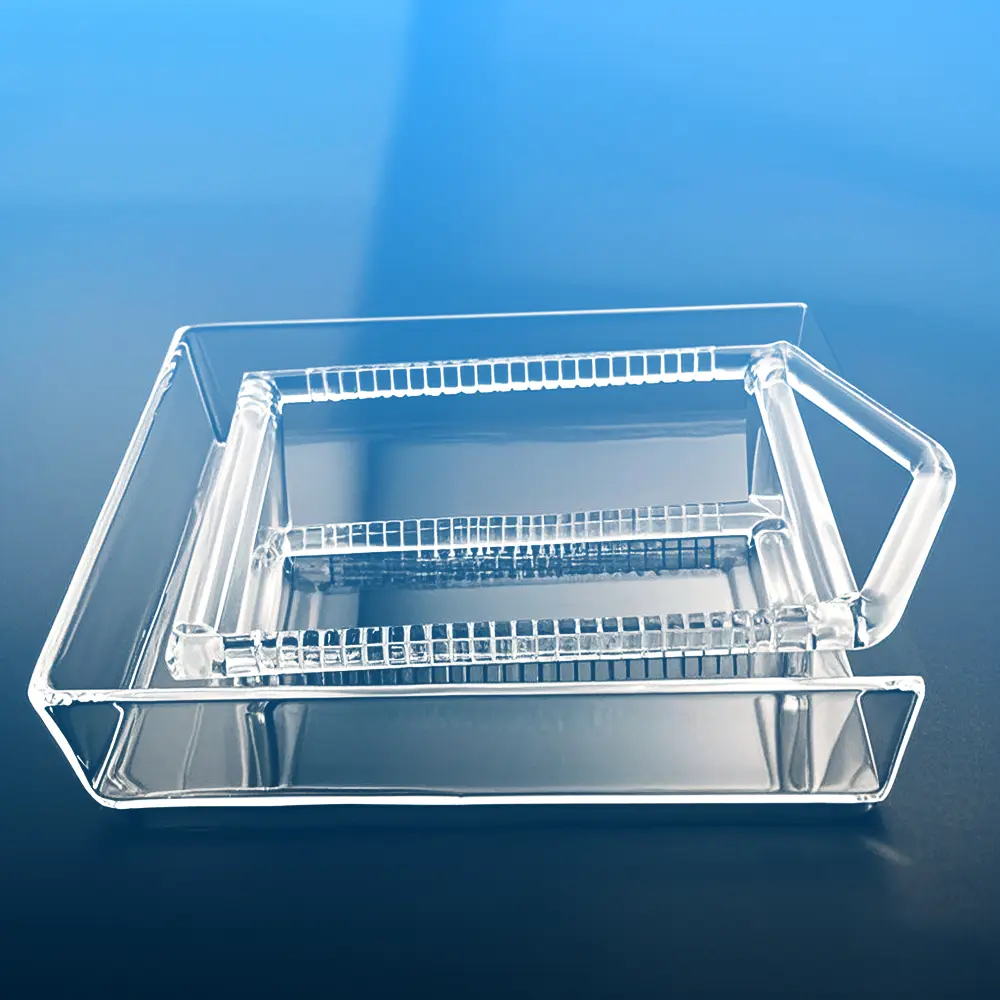 Top-angle view showing the parallel slots of the quartz boat within its carrier tray.