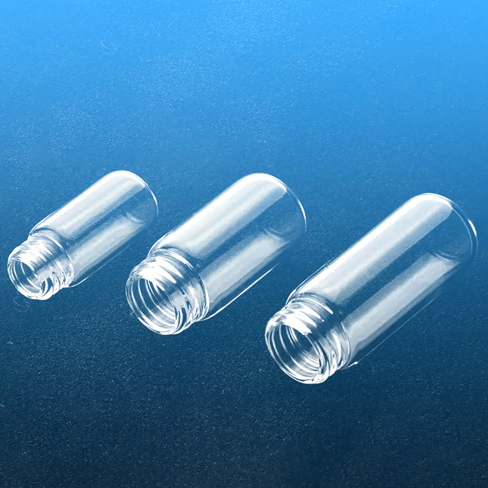 Close-up view focusing on the screw thread necks of three clear quartz glass vials
