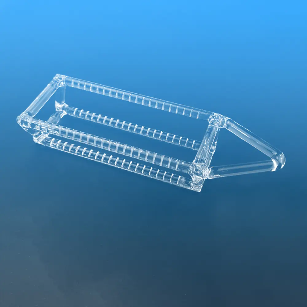 Angled view of a clear slotted quartz annealing boat for wafer thermal processing