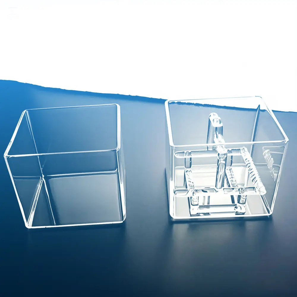 Clear quartz wafer cleaning tank shown alongside its matching inner slotted quartz wafer rack